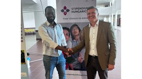 handshake with the representative from Kenya